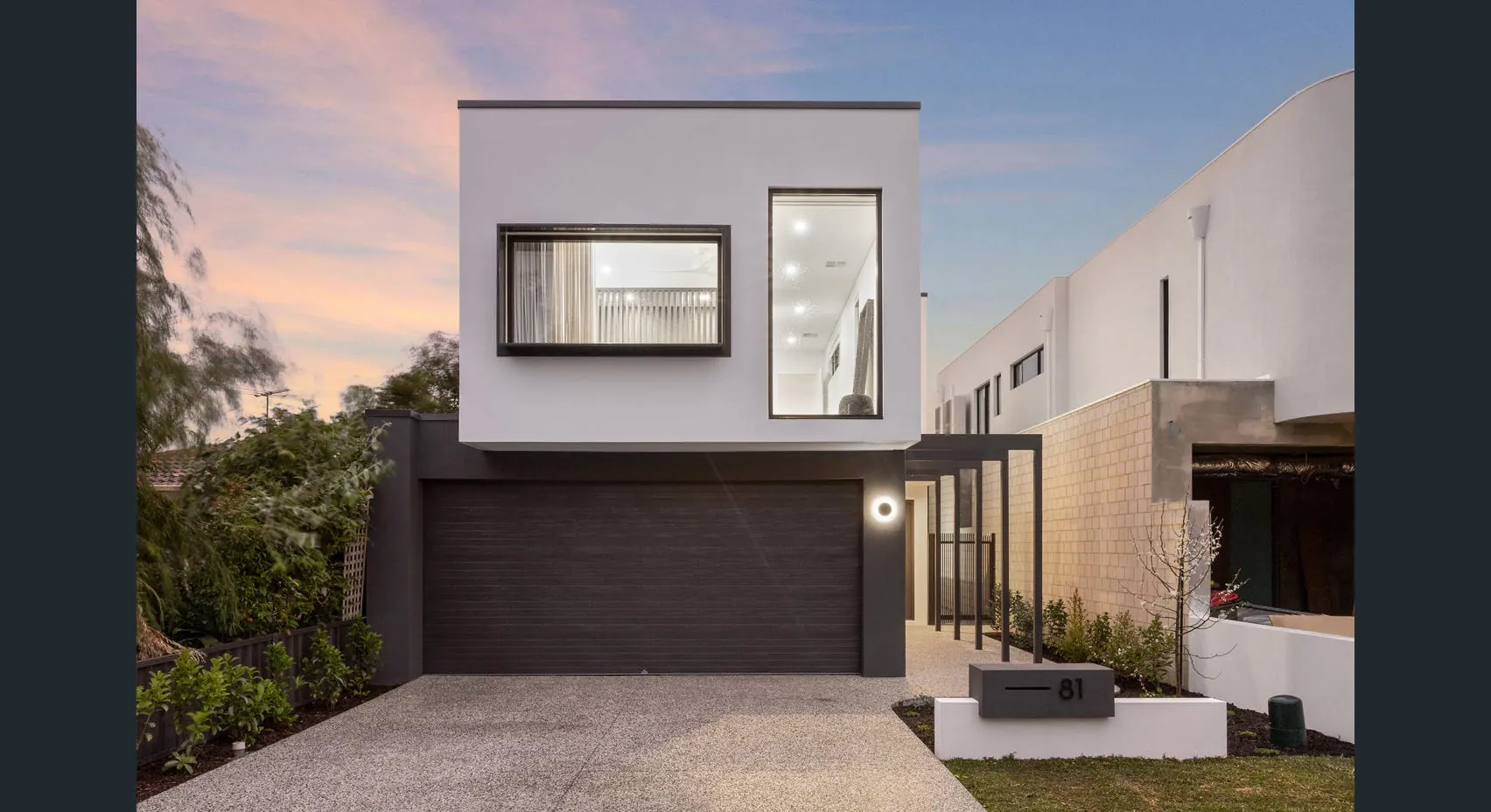 A completed xtrude residence at dusk, design-led infill development
